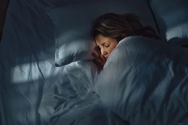Dimly lit bedroom with controlled ambient lighting