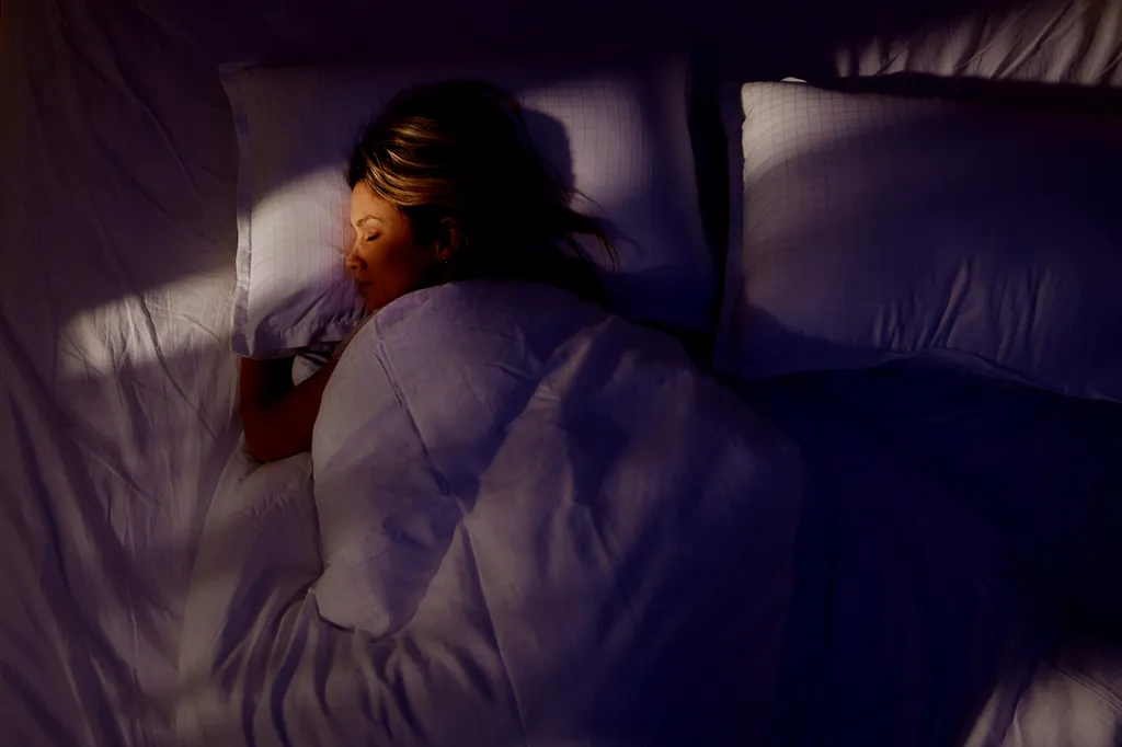 Compact white noise generator on bedside table